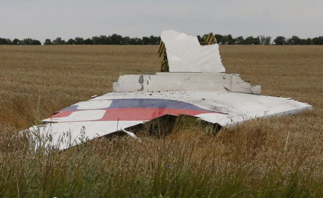 Part of the wreckage of a Malaysia Airlines Boeing 777 plane is seen after it crashed near the settlement of Grabovo in the Donetsk region